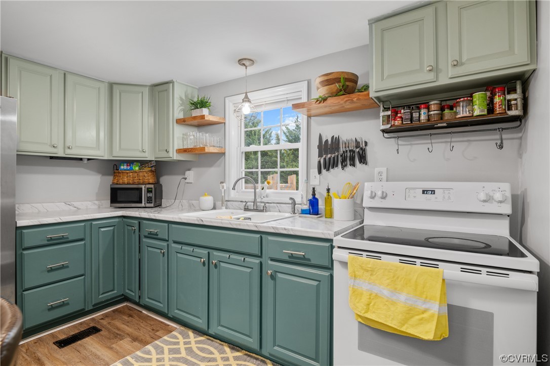 12901 Ruth Hill Road Church Road, VA 23833 - Photo 23 of 50 a kitchen with stainless steel appliances granite countertop a sink and cabinets