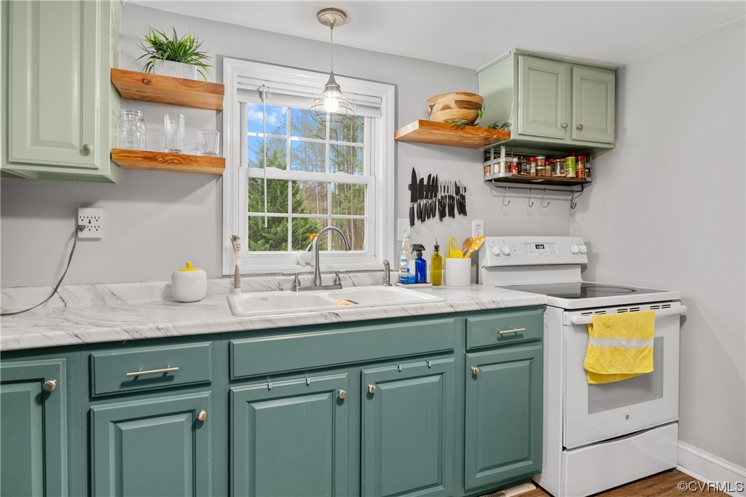 12901 Ruth Hill Road Church Road, VA 23833 - Photo 24 of 50 a kitchen with stainless steel appliances granite countertop a sink dishwasher and cabinets with wooden floor
