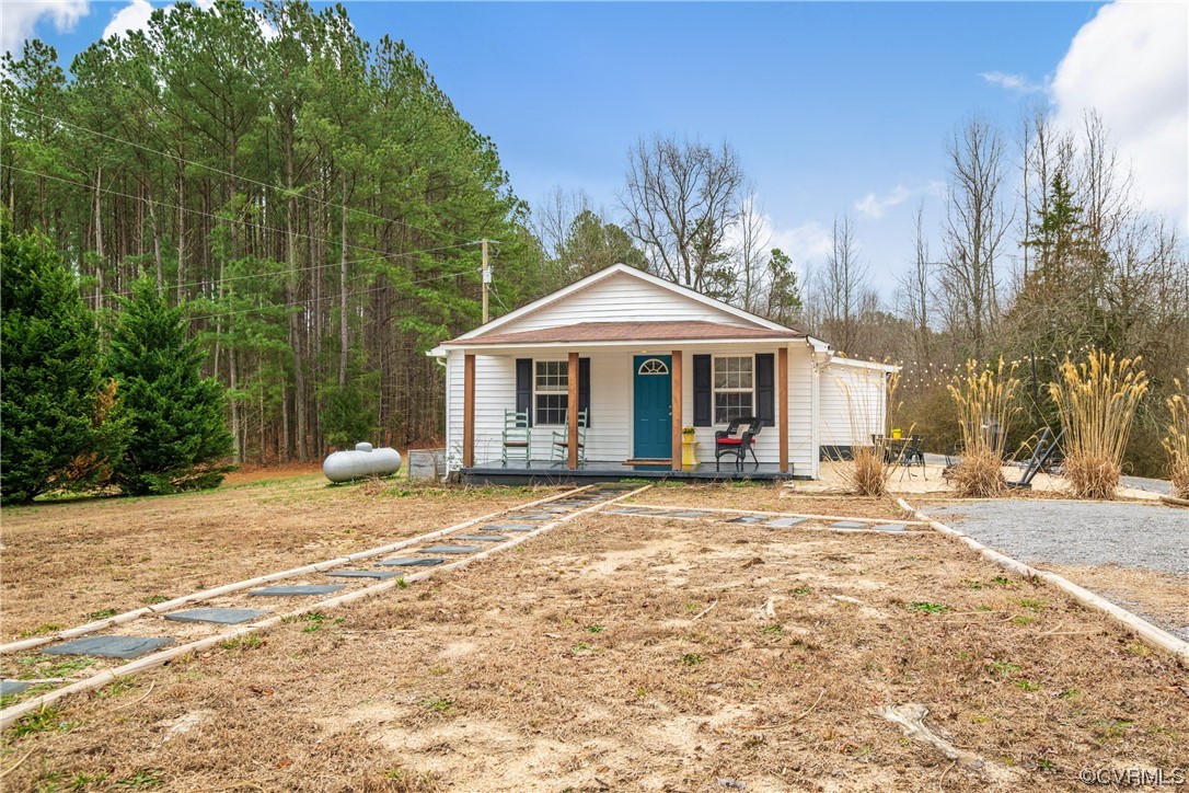 12901 Ruth Hill Road Church Road, VA 23833 - Photo 3 of 50 a front view of a house with a garden and trees