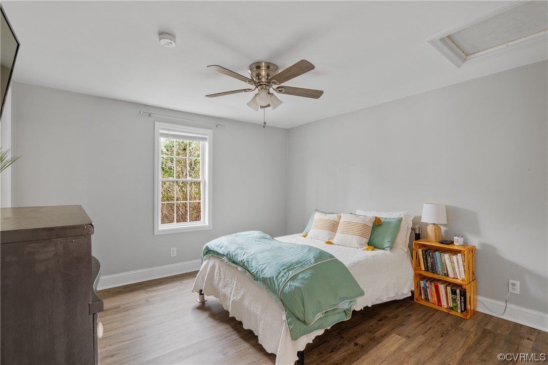 12901 Ruth Hill Road Church Road, VA 23833 - Photo 33 of 50 a bedroom with a bed and wooden floor