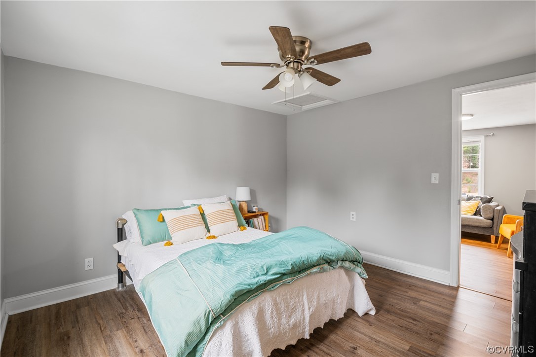 12901 Ruth Hill Road Church Road, VA 23833 - Photo 35 of 50 a bedroom with a bed and wooden floor