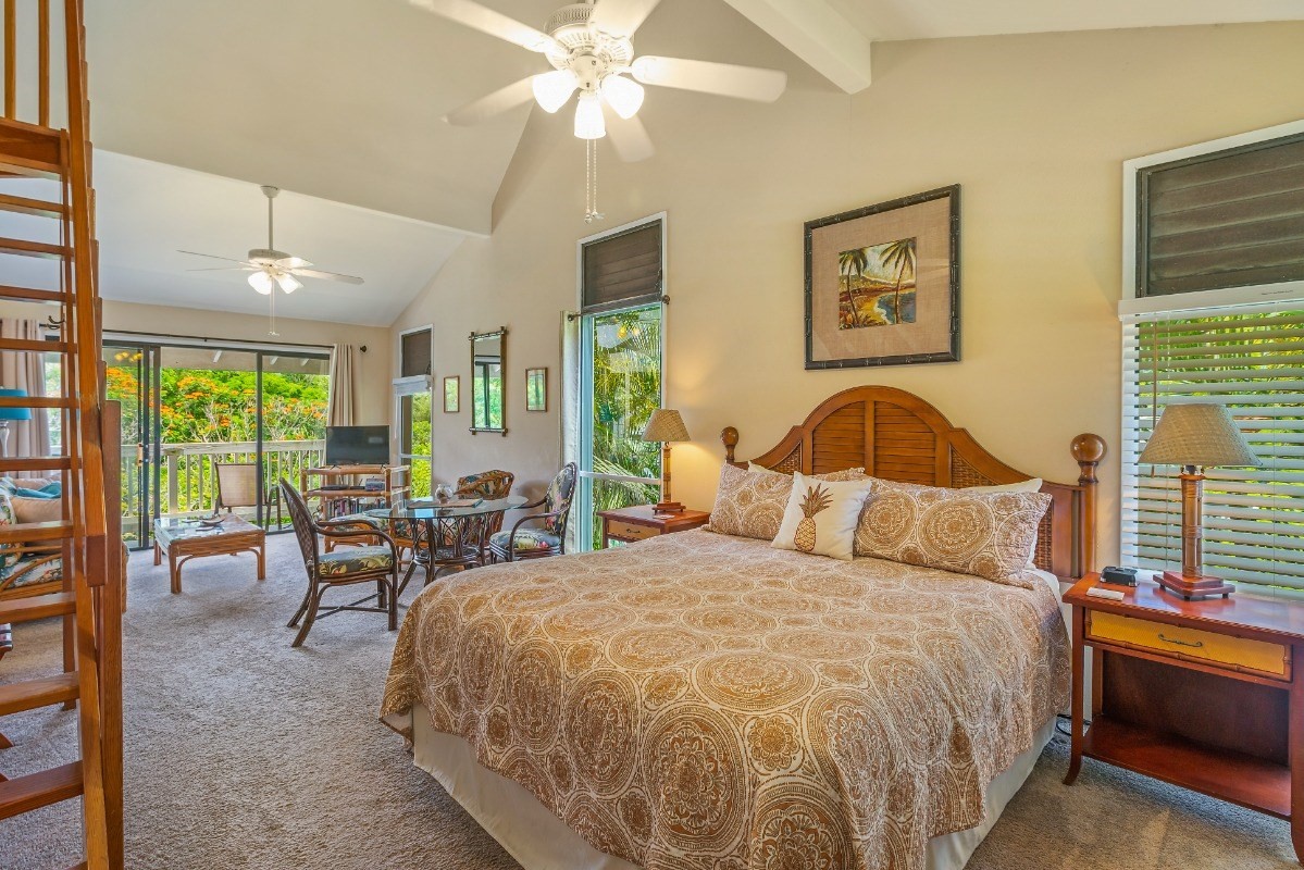5301 Ka Haku Road, Unit 208 Princeville, HI 96722 - Photo 12 of 27 a bedroom with a bed and large window