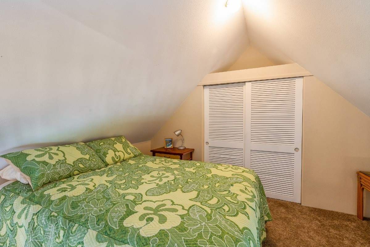 5301 Ka Haku Road, Unit 208 Princeville, HI 96722 - Photo 14 of 27 a bedroom with a bed and a window
