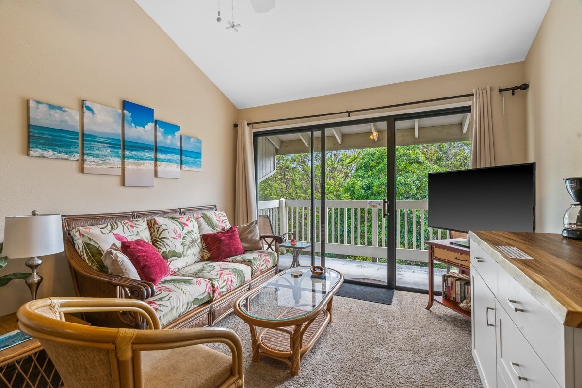 5301 Ka Haku Road, Unit 208 Princeville, HI 96722 - Photo 16 of 27 a living room with furniture and a floor to ceiling window