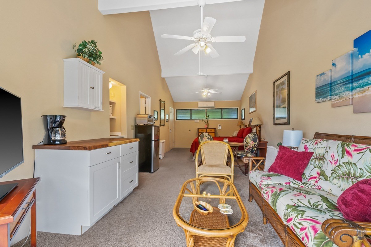 5301 Ka Haku Road, Unit 208 Princeville, HI 96722 - Photo 22 of 27 a living room with furniture and kitchen view