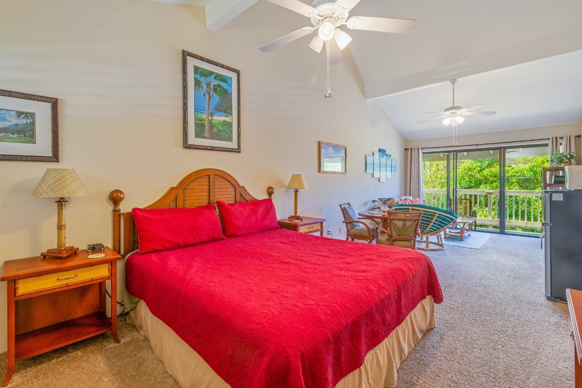 5301 Ka Haku Road, Unit 208 Princeville, HI 96722 - Photo 26 of 27 a bedroom with a bed and a window