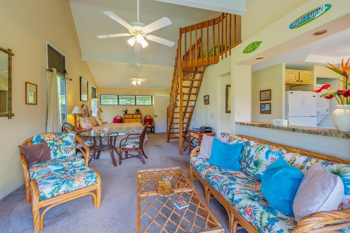 5301 Ka Haku Road, Unit 208 Princeville, HI 96722 - Photo 5 of 27 a living room with furniture fireplace and a potted plant