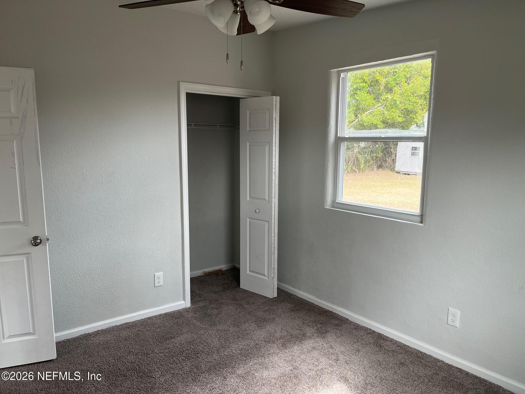 10547 Briarcliff Road East Jacksonville, FL 32218 - Photo 17 of 33 an empty room with windows and closet