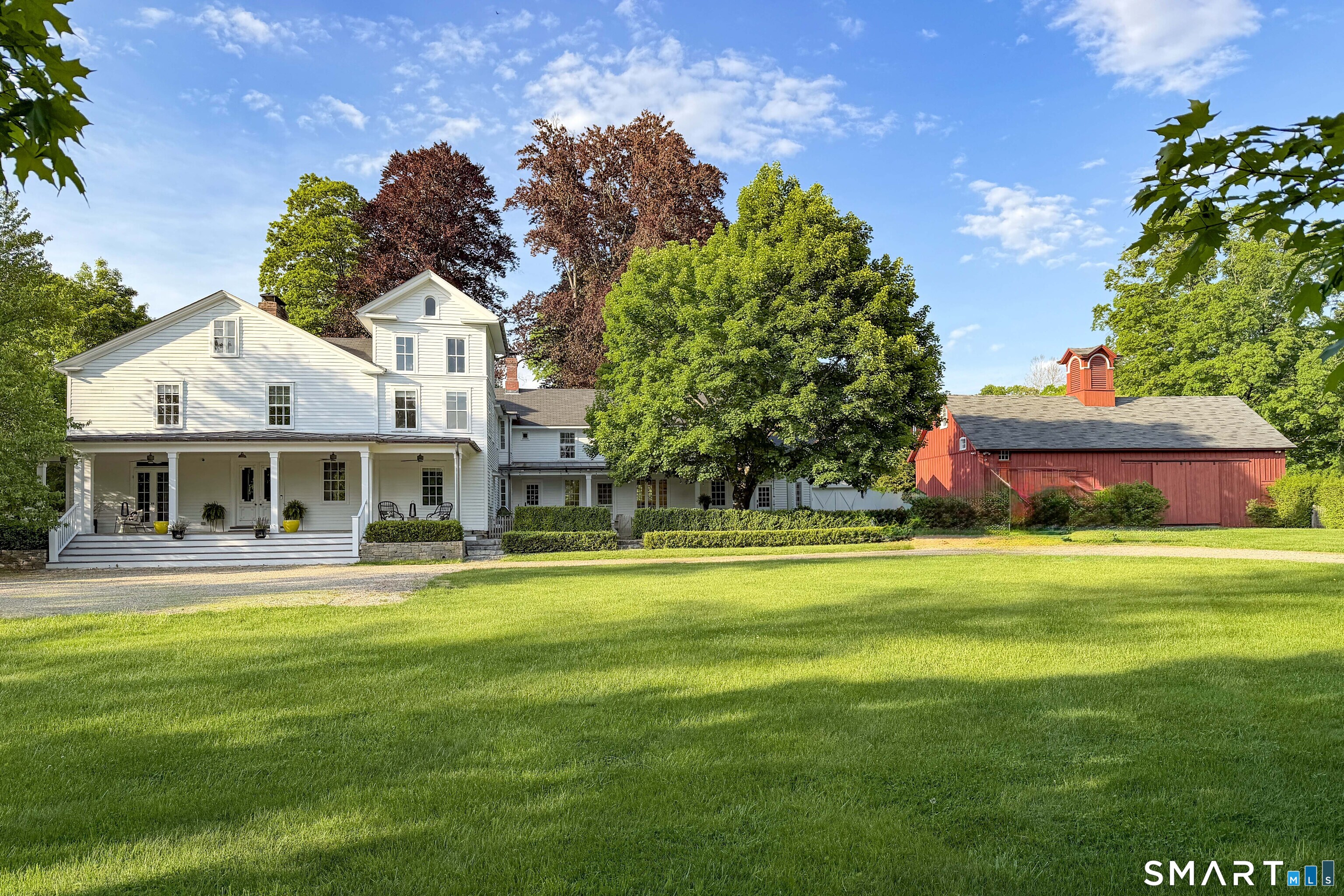 100 North Main Street Kent, CT 06757 - Photo 1 of 40 a front view of a house with a garden