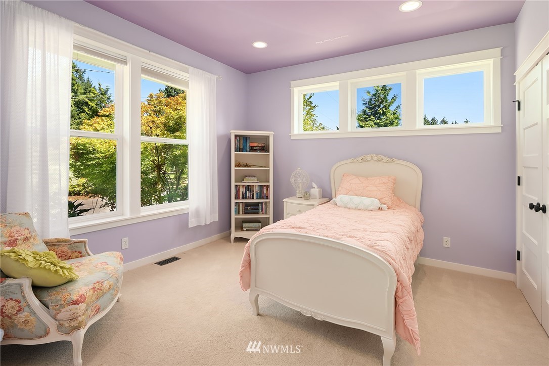 4726 166th Place Southeast Bothell, WA 98012 - Photo 22 of 34 a bedroom with a bed and a large window