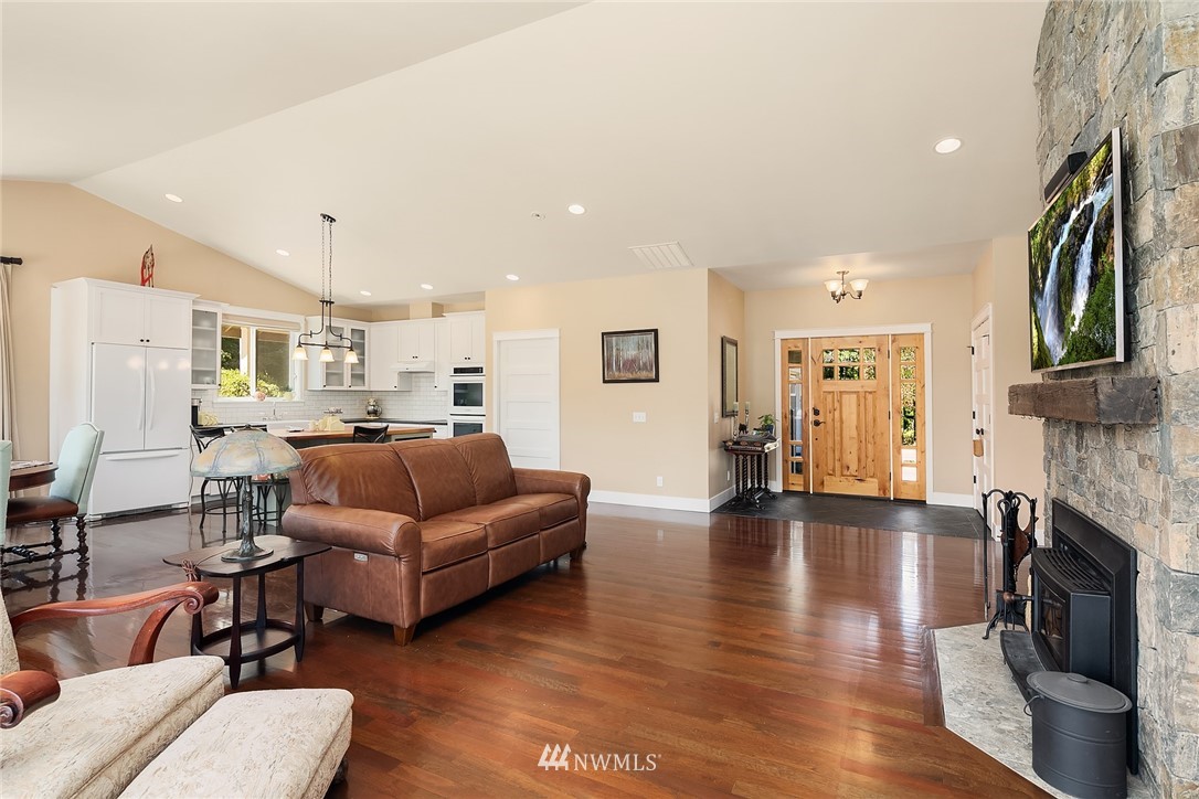 4726 166th Place Southeast Bothell, WA 98012 - Photo 8 of 34 a living room with furniture and a fireplace
