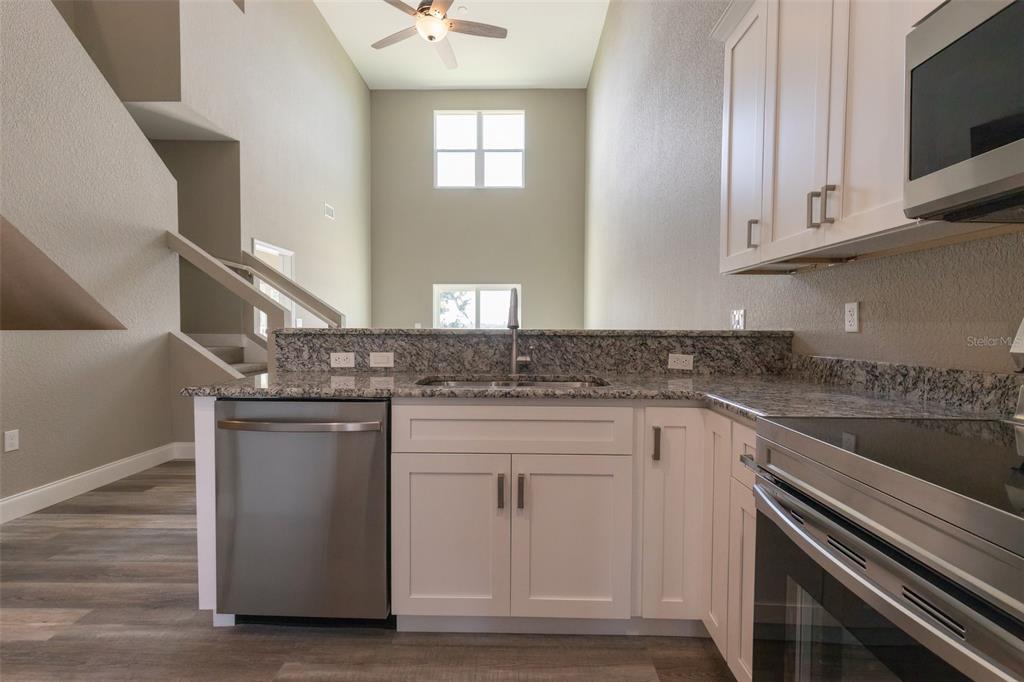 1877 Arbuckle Creek Road Sebring, FL 33870 - Photo 21 of 50 a kitchen with cabinets appliances and a sink