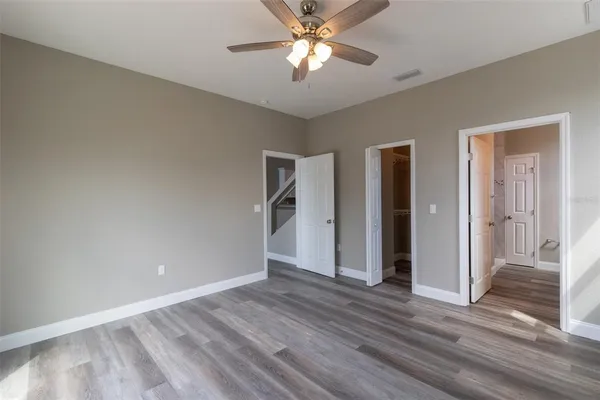 a spacious bathroom with a sink and a mirror
