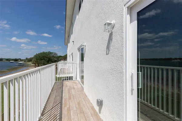 a view of balcony with wooden floor