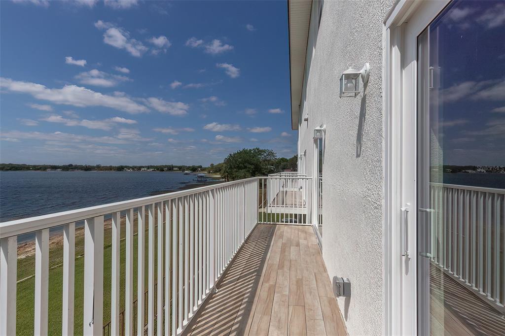 1877 Arbuckle Creek Road Sebring, FL 33870 - Photo 31 of 50 a view of balcony with wooden floor and fence