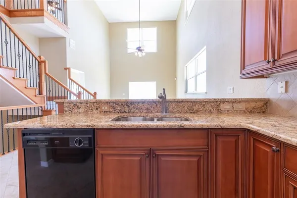 a kitchen with stainless steel appliances granite countertop a stove and a sink
