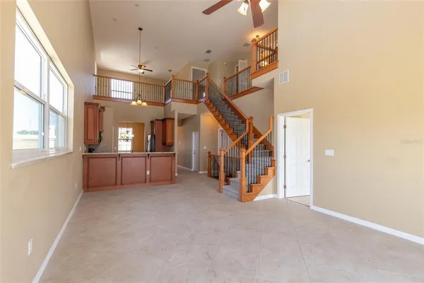 a spacious bathroom with a double vanity sink and a mirror