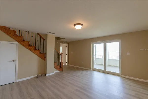 a view of an entryway with wooden floor
