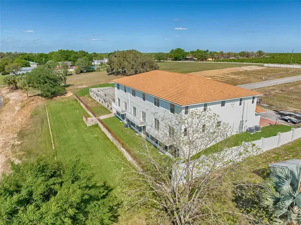 a view of a big building with a big yard