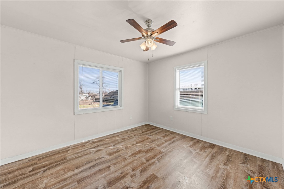 906 South 2nd Street Temple, TX 76504 - Photo 23 of 41 a view of a big room with wooden floor and windows