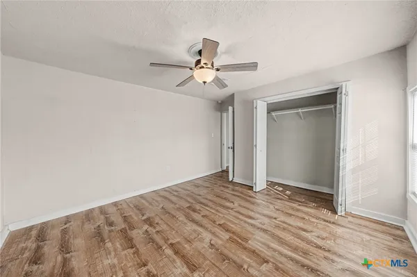 a view of a park with large trees