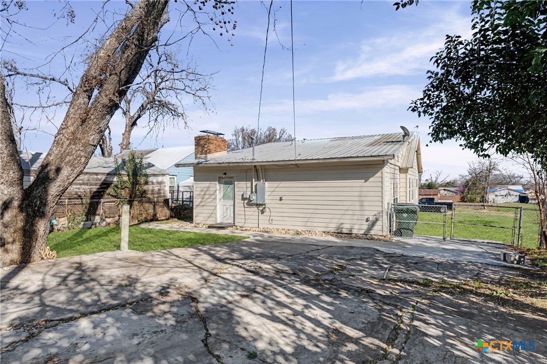 906 South 2nd Street Temple, TX 76504 - Photo 33 of 41 a view of a house with a yard and sitting area