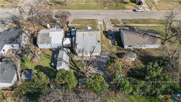 an aerial view of houses with outdoor space