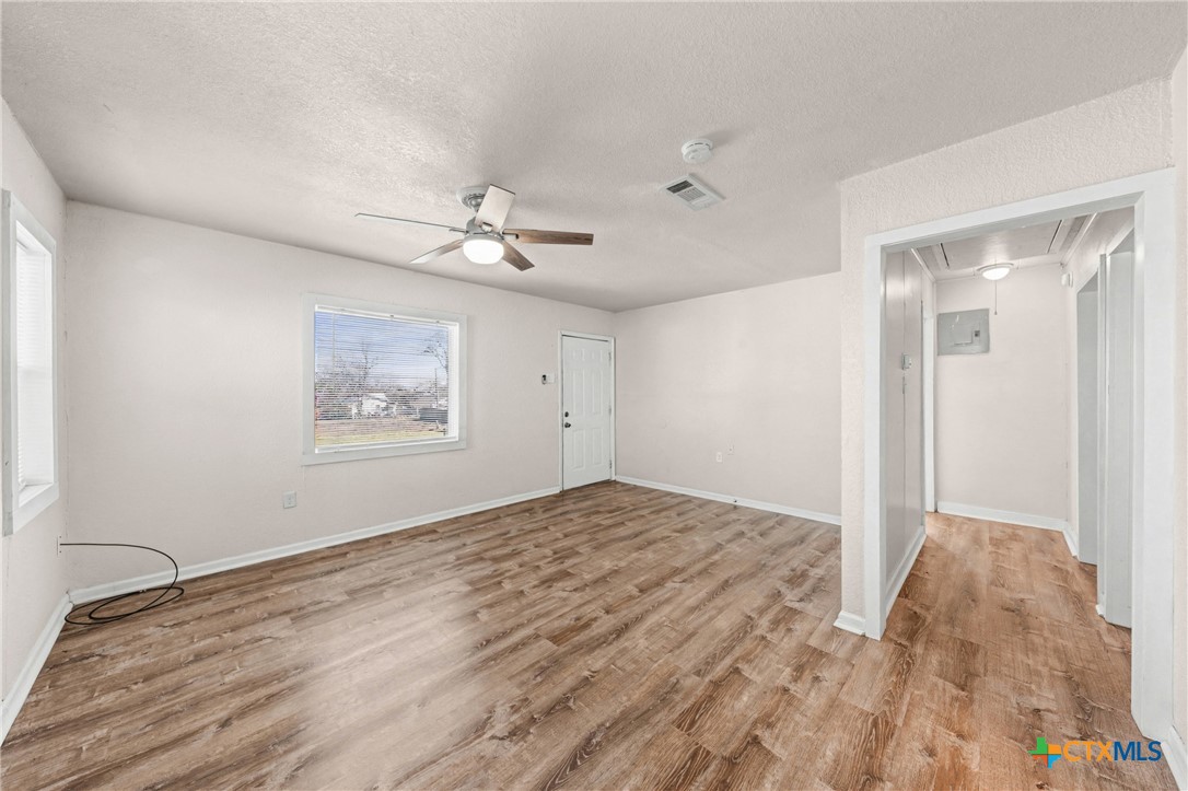 906 South 2nd Street Temple, TX 76504 - Photo 7 of 41 a view of empty room with a ceiling fan
