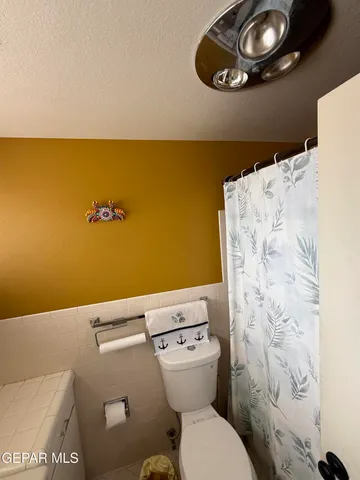 a bathroom with a toilet and a sink
