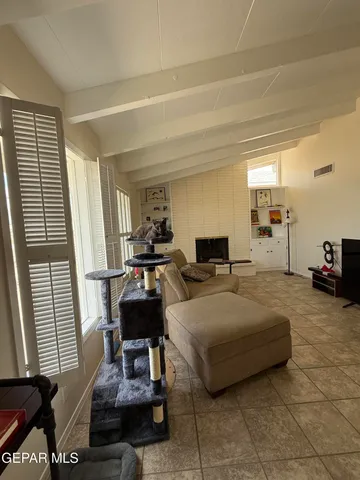 a living room with furniture and a window