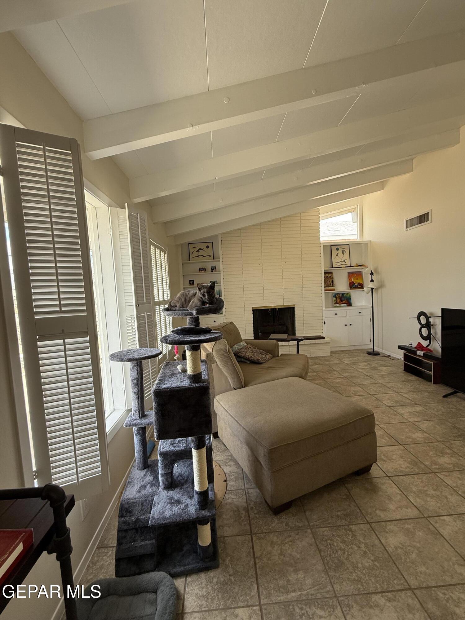 313 Clairemont Road El Paso, TX 79912 - Photo 13 of 34 a living room with furniture and a window