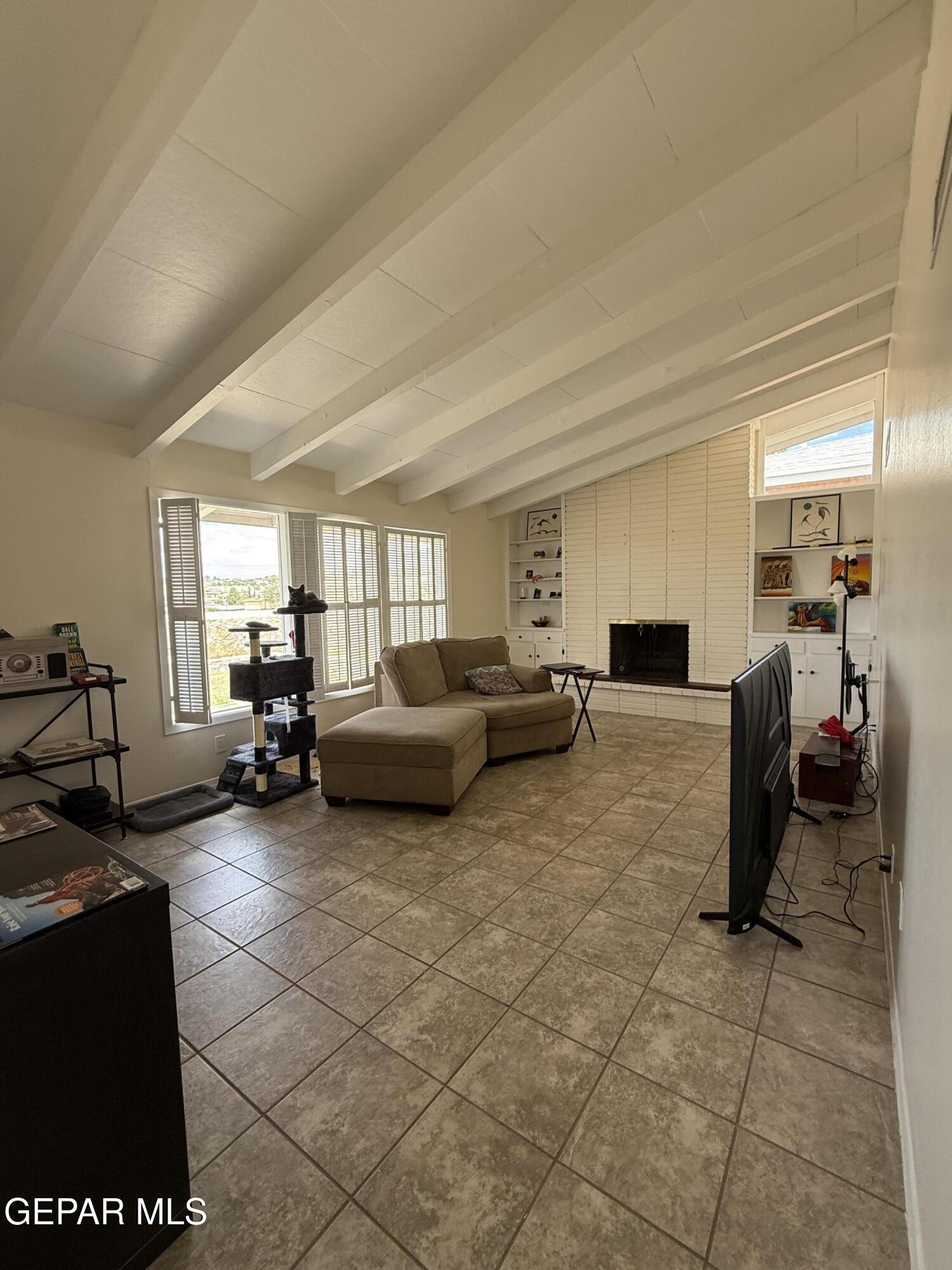 313 Clairemont Road El Paso, TX 79912 - Photo 14 of 34 a living room with furniture and a couch