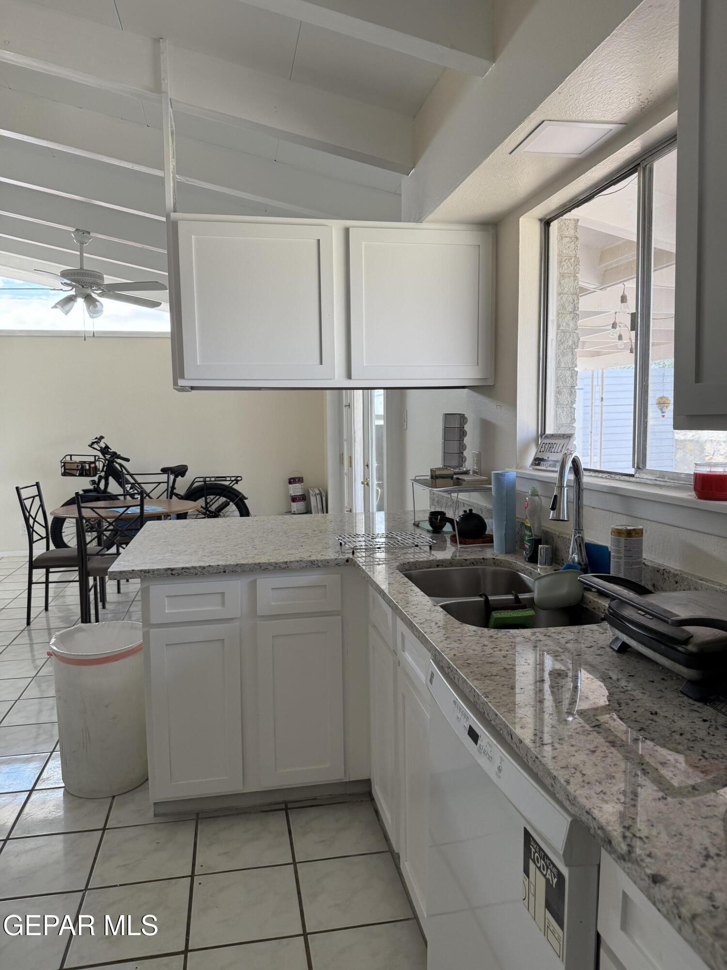 313 Clairemont Road El Paso, TX 79912 - Photo 18 of 34 a kitchen with a sink and cabinets