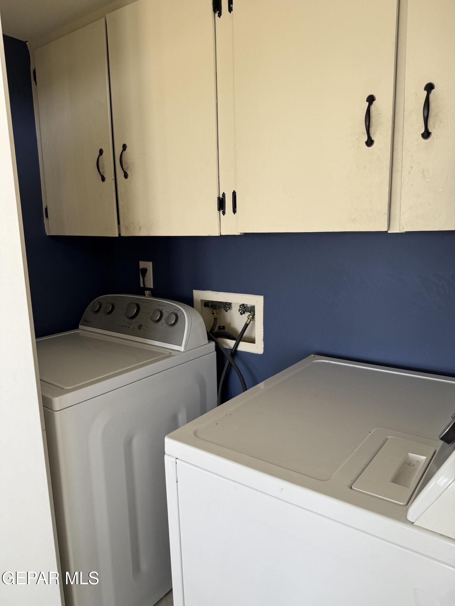 313 Clairemont Road El Paso, TX 79912 - Photo 25 of 34 a utility room with dryer and washer
