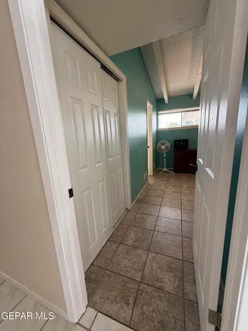 a view of utility room with two washing machine