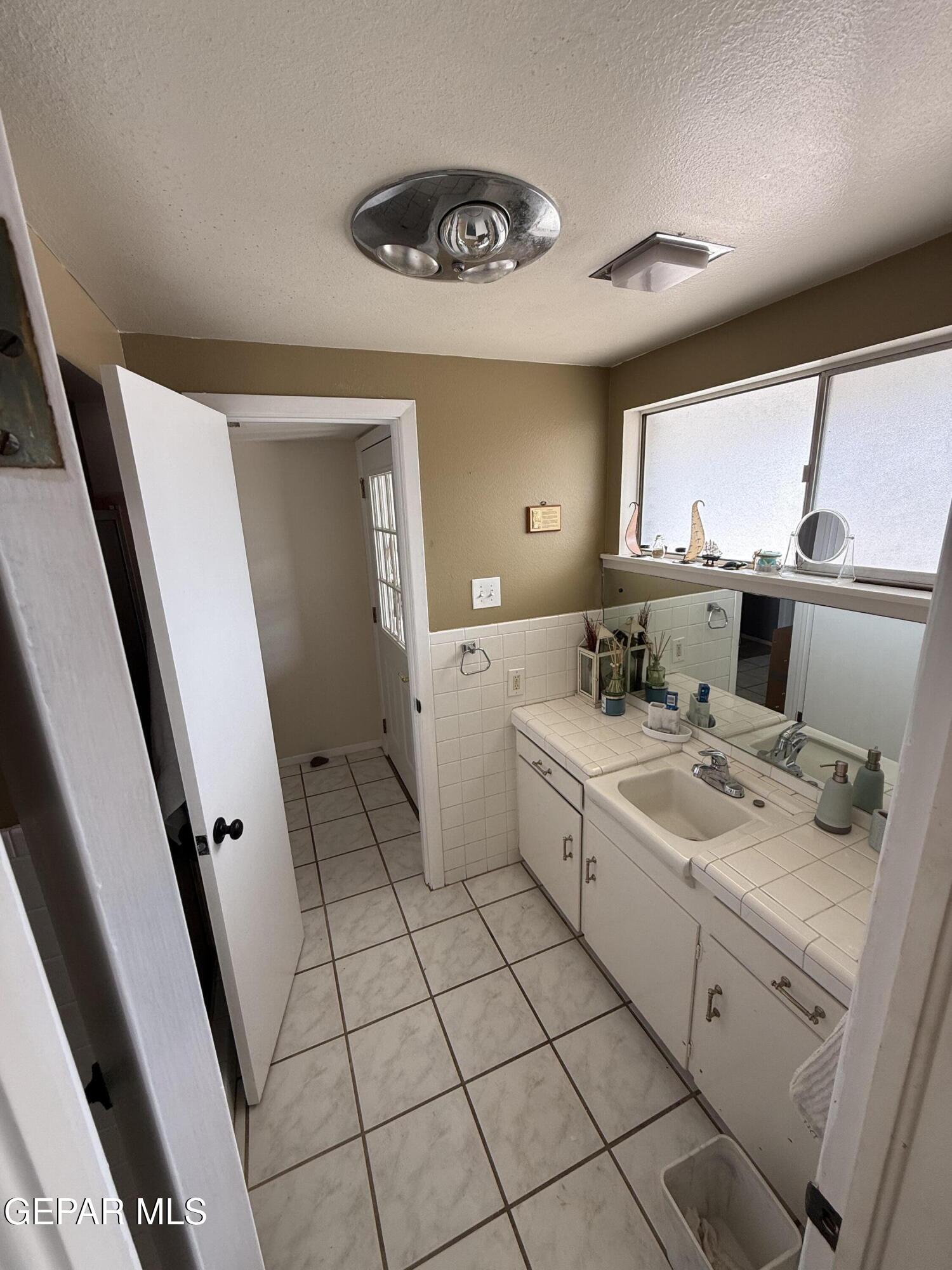 313 Clairemont Road El Paso, TX 79912 - Photo 30 of 34 a view of utility room with two washing machine
