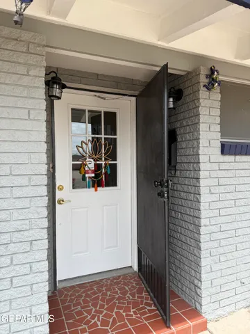 a view of a door and a window