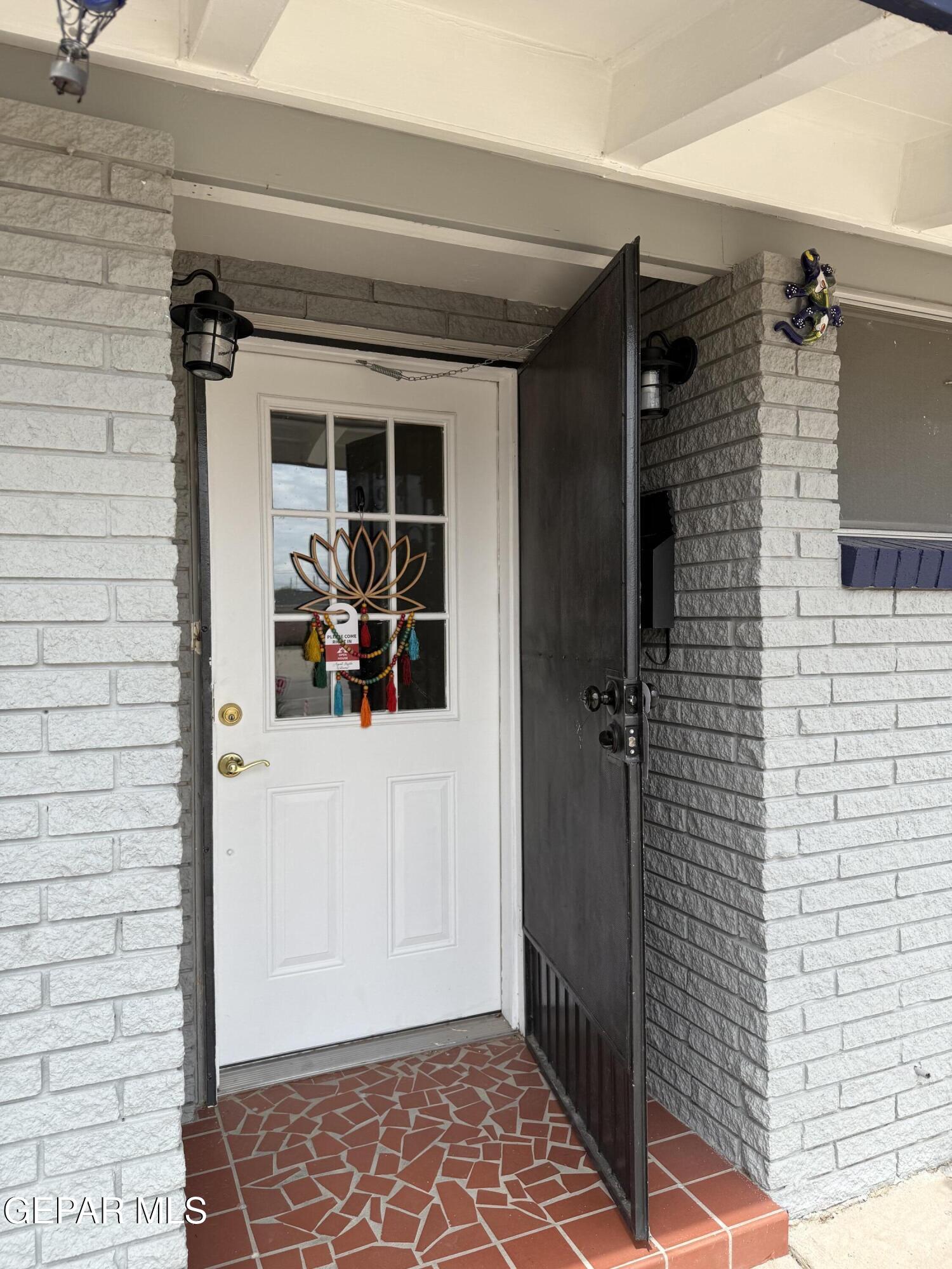 313 Clairemont Road El Paso, TX 79912 - Photo 5 of 34 a view of a door and a window