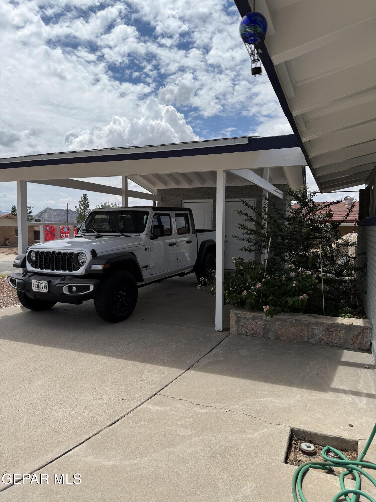313 Clairemont Road El Paso, TX 79912 - Photo 6 of 34 a car parked in garage