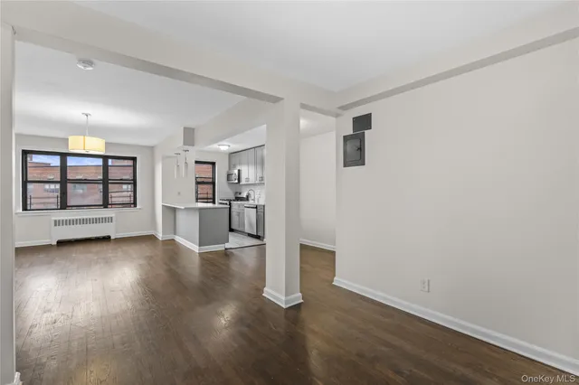 a view of a kitchen with a dishwasher and wooden floor