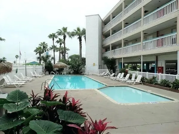 a view of a swimming pool with a patio