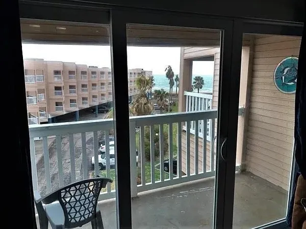 a view of a balcony with chair