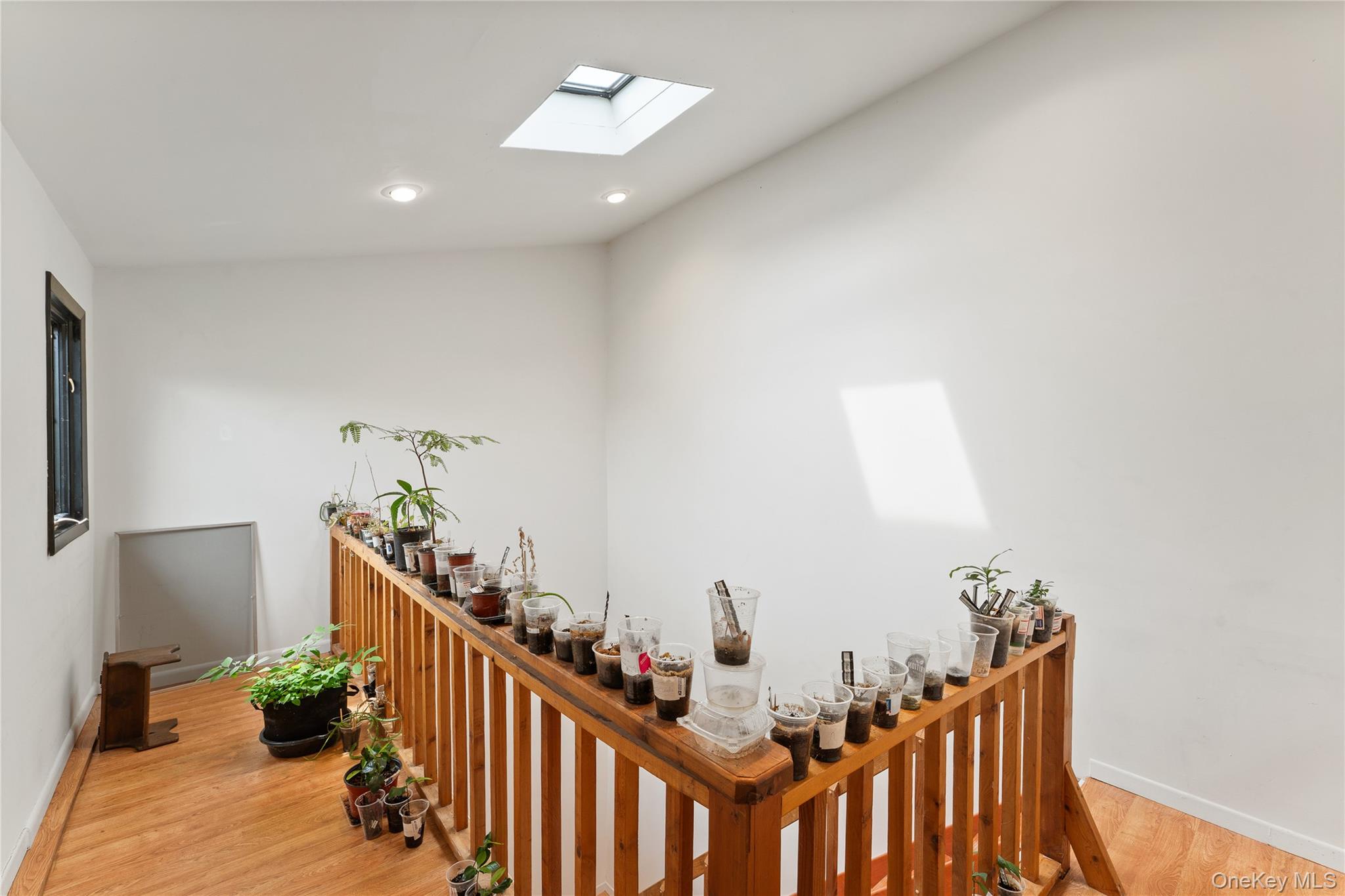147 I U Willets Road Albertson, NY 11507 - Photo 13 of 14 a view of hallway with wooden floor