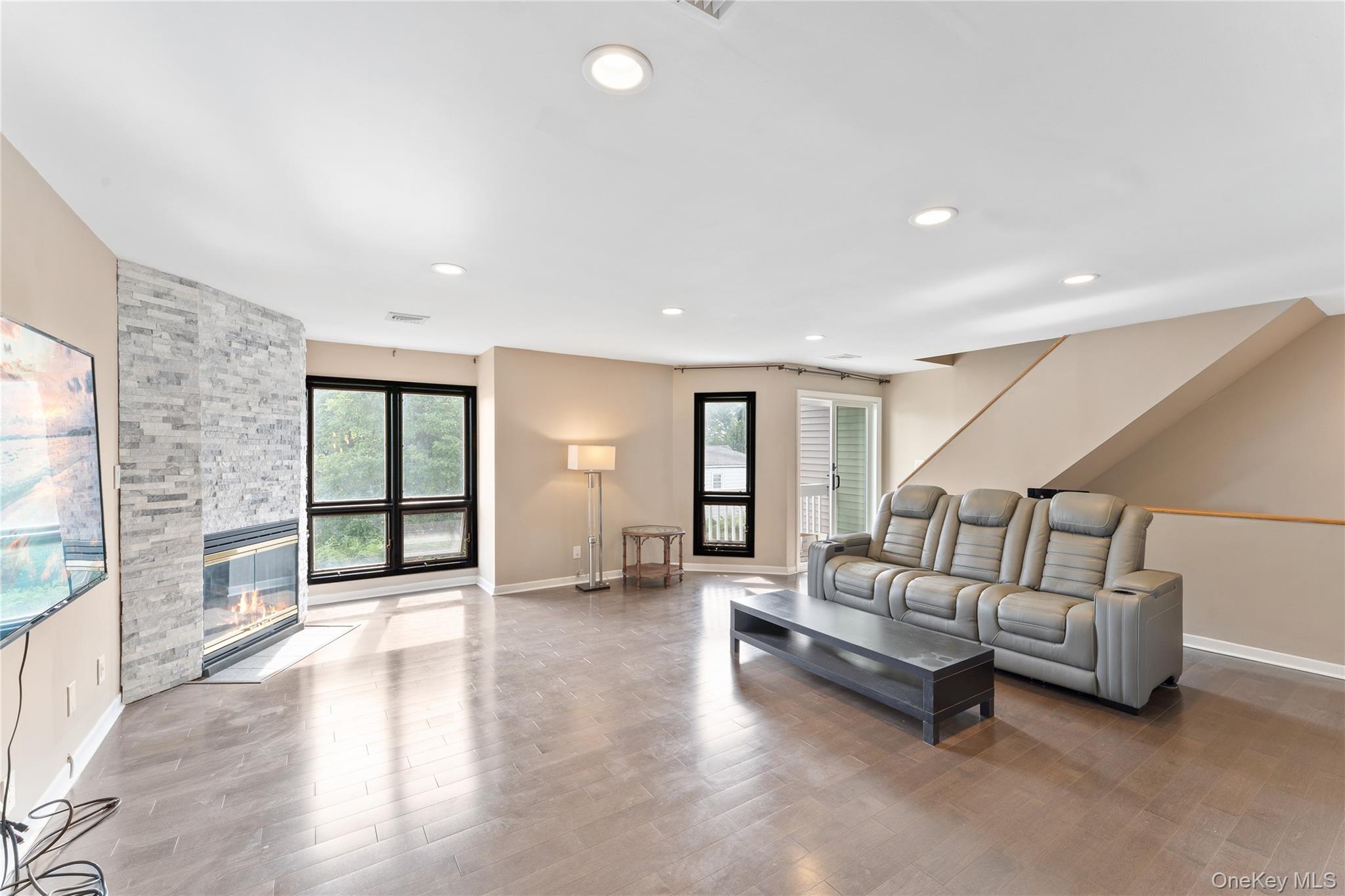 147 I U Willets Road Albertson, NY 11507 - Photo 3 of 14 a living room with furniture and a large window