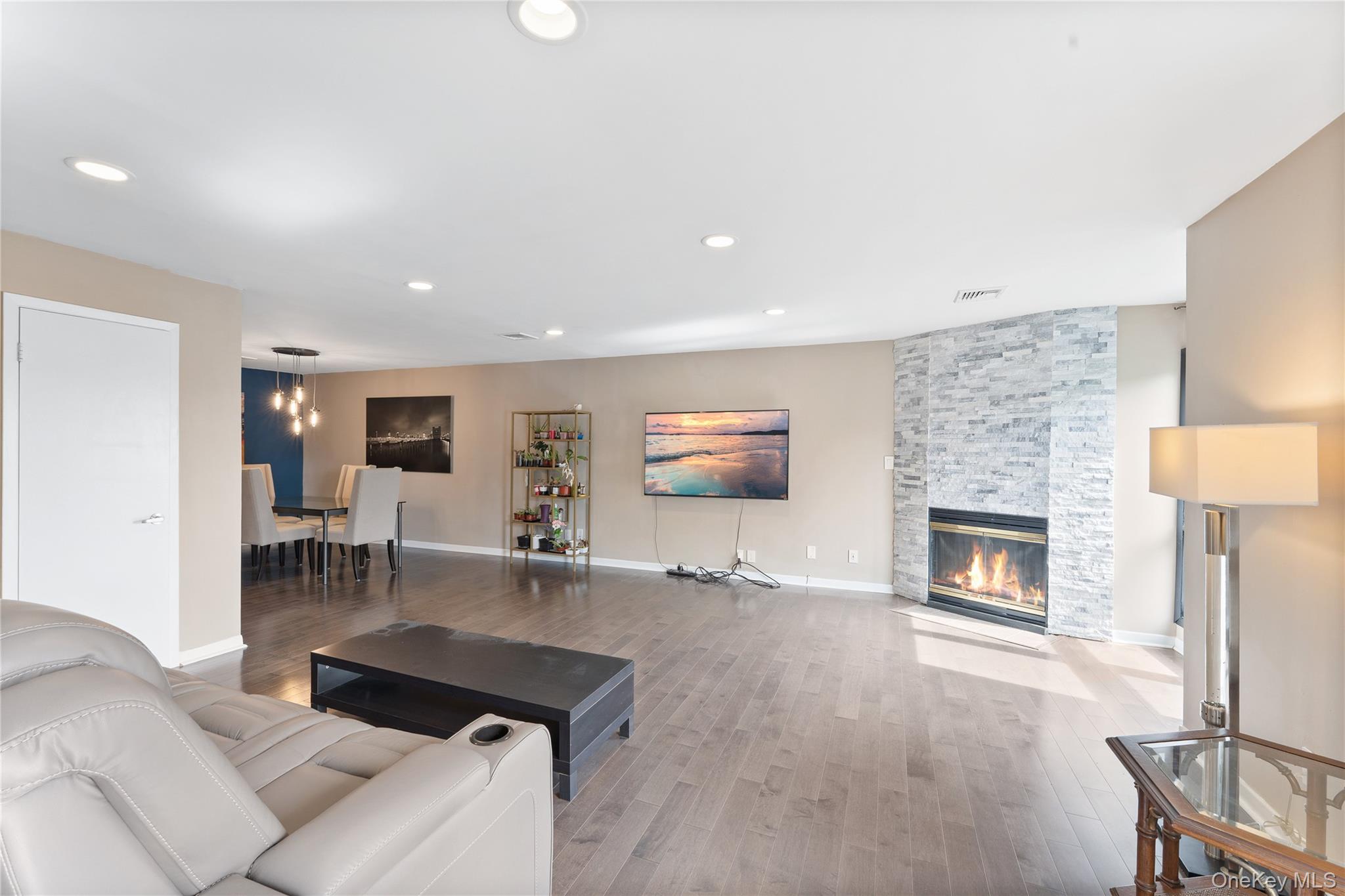 147 I U Willets Road Albertson, NY 11507 - Photo 4 of 14 a living room with furniture and a fireplace