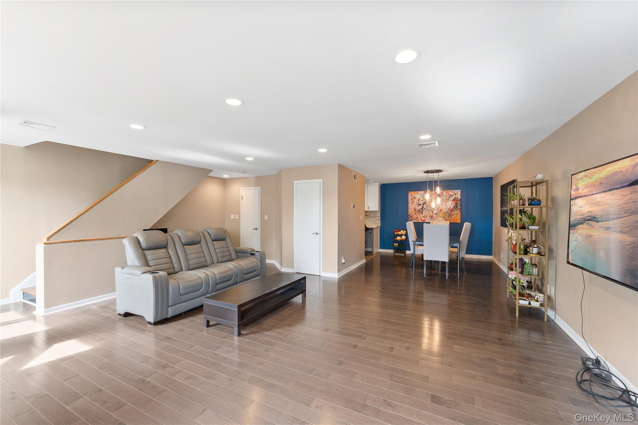 147 I U Willets Road Albertson, NY 11507 - Photo 5 of 14 a living room with furniture and a flat screen tv