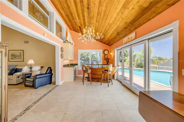 a large kitchen with stainless steel appliances kitchen island granite countertop a refrigerator and a stove top oven