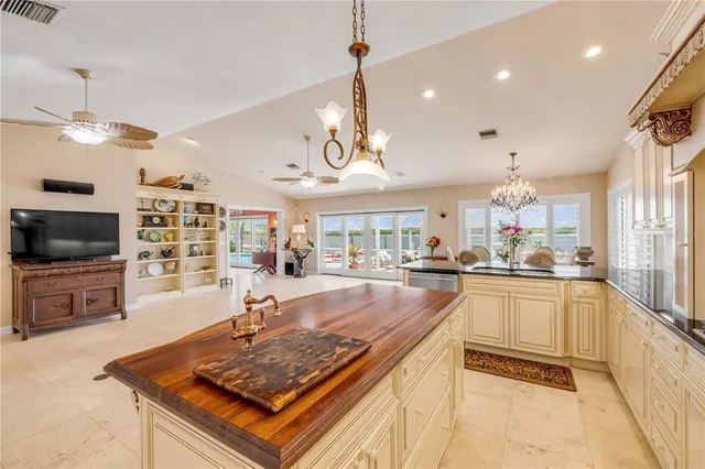 a kitchen with granite countertop cabinets and window