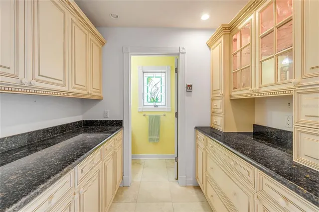 a bedroom with a bed and a ceiling fan