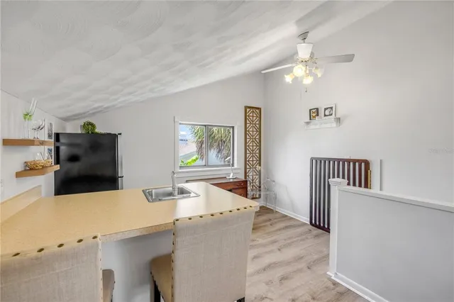 a view of a house with swimming pool and sitting area